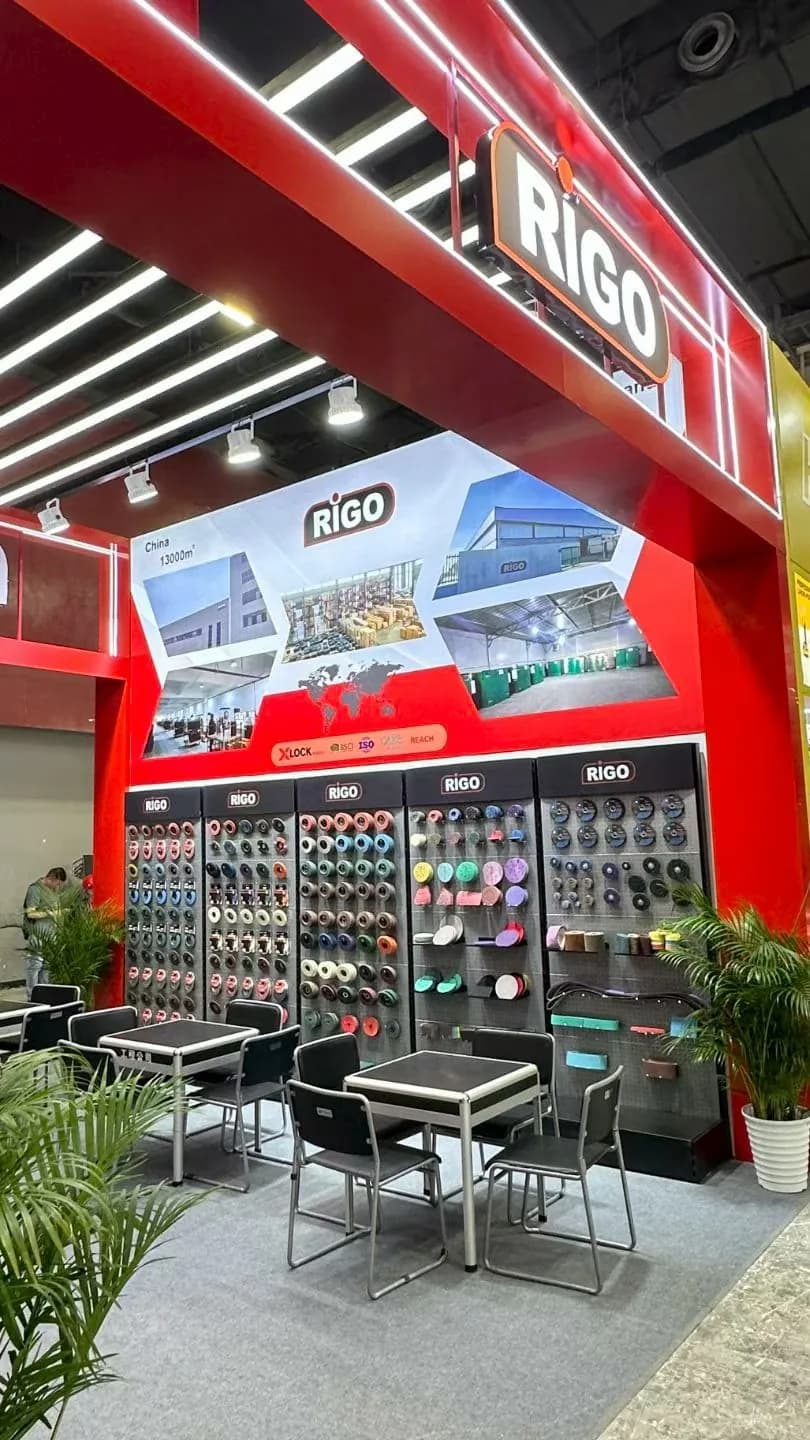 RIGO exhibition booth with product displays and meeting area