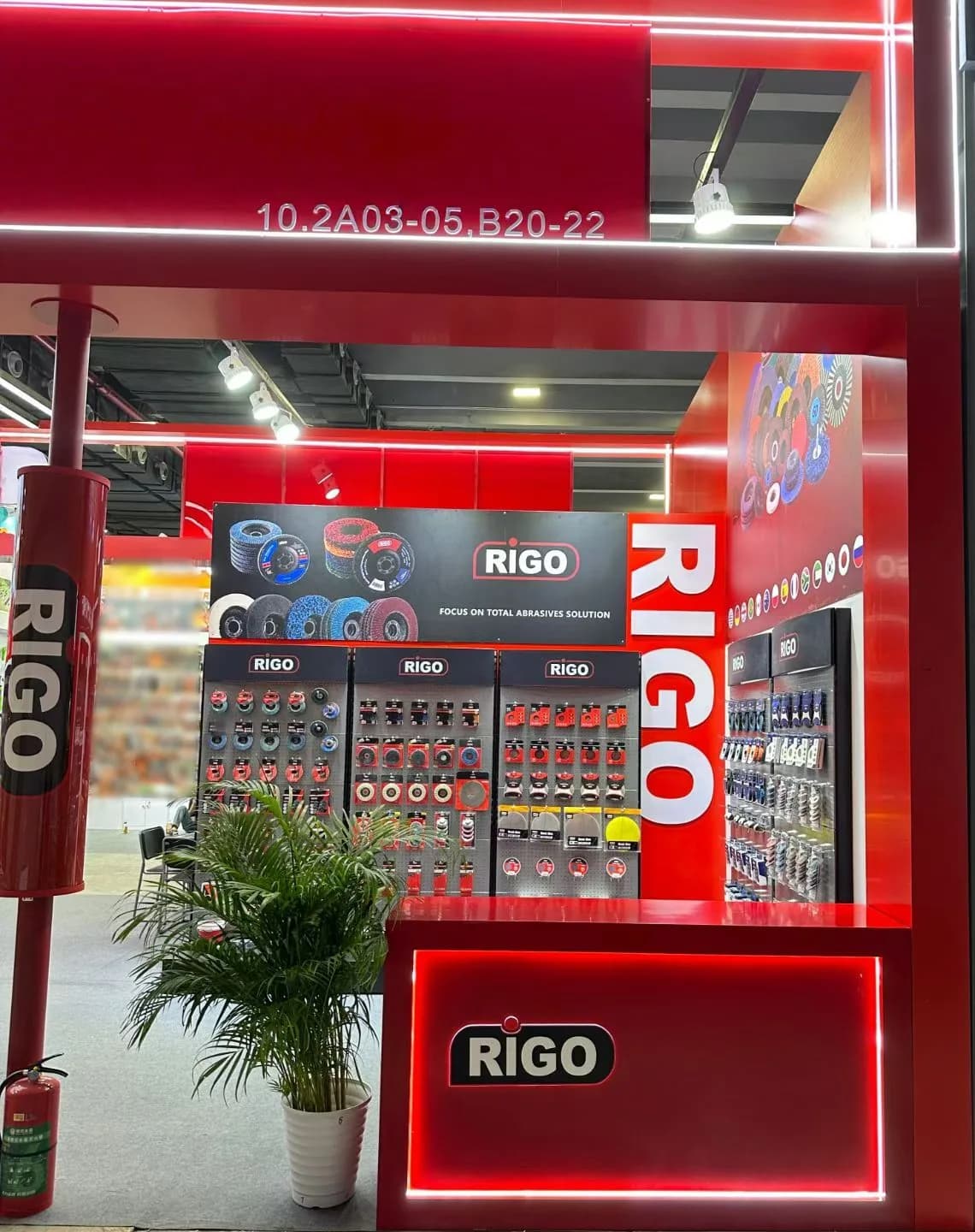 RIGO exhibition booth entrance and illuminated brand display
